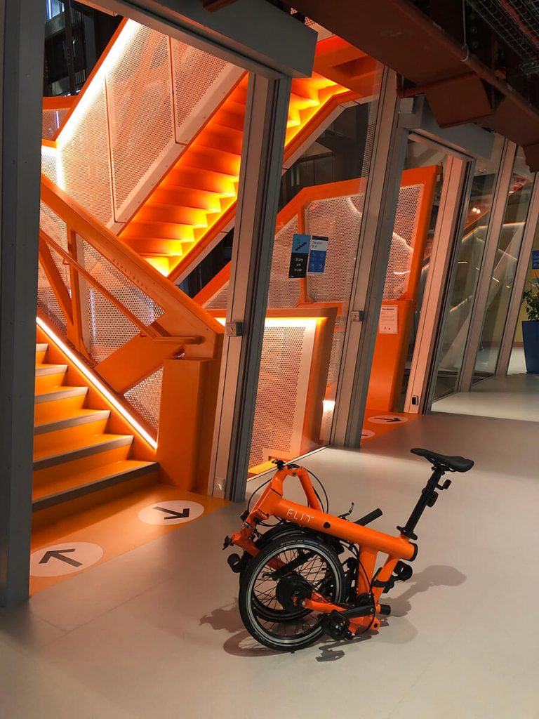 FLIT bike blaze orange at the office